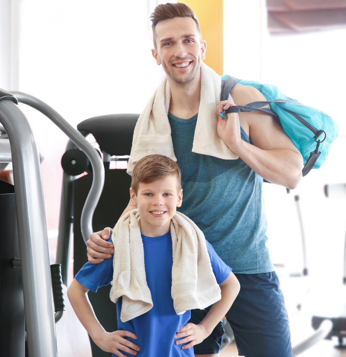 a father and a kid using towel after gym session